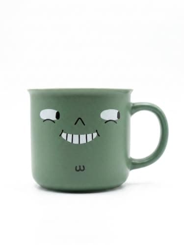Porcelain Mug with Expressive Face Design for Hot and Cold Beverages. (Matte green mug with a funny toothy smile and matching handle.)