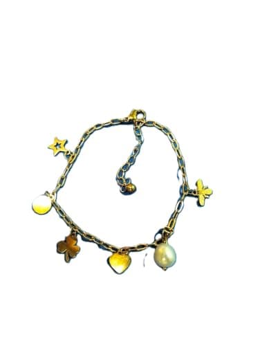 Gold charm bracelet with a star, heart, and pearl
