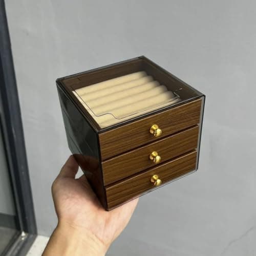 Generic Acrylic accessory organizer with wooden drawers, It features three drawers with various compartments and metal drawer handles, .Ais