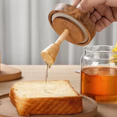 Generic Glass honey jar with a wooden spoon,Comes with a built-in wooden spoon that makes using honey easy,A tight lid to prevent leaks, .bs