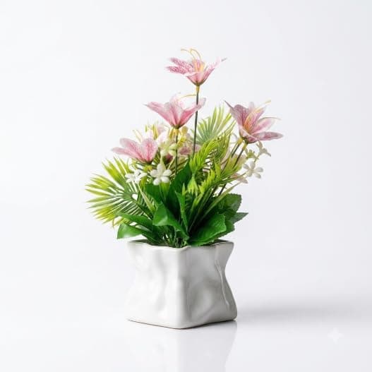 White plastic vase decorated with pink flowers and green leaves