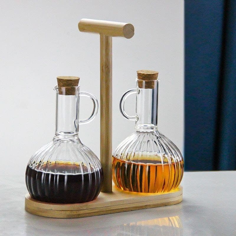 Generic 2-piece oil set with glass bottles,On a bamboo wood base,Oil and vinegar bottles With tight-fitting metal lids,Imported product, .ex