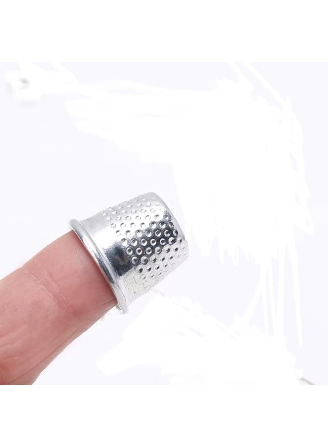 A brass thimble for sewing, embroidery, knitting, and finger protection. Sewing Machine Accessories (3)