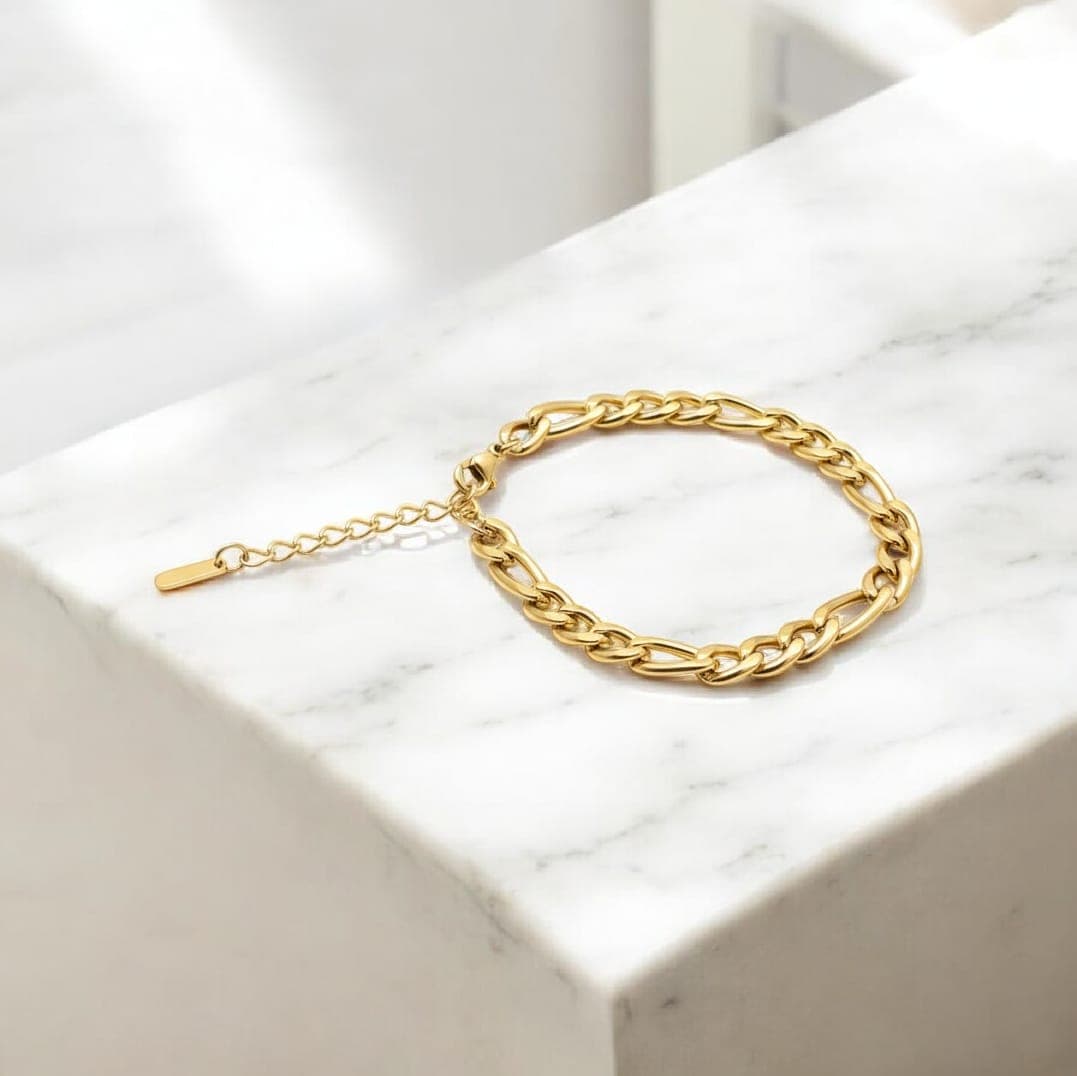 A stainless steel bracelet with interconnected oval and circular links. It features a classic, shiny chain design and an adjustable clasp to fit your wrist. Women's Bracelets & Bangles (٤)