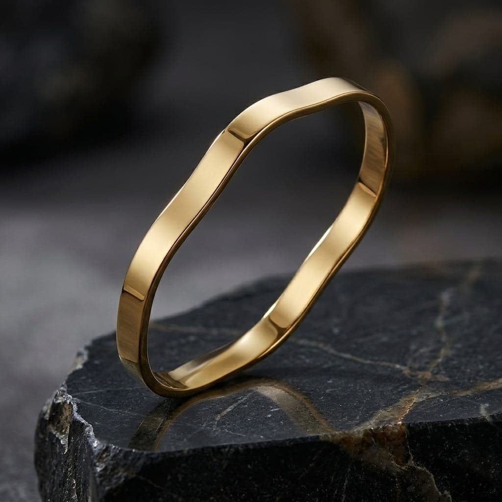 A luxurious bracelet in elegant gold, featuring a unique, flowing, and polished wave design. It adds a touch of modern luxury to your look. An attractive design for any occasion. Women's Bangles (4)