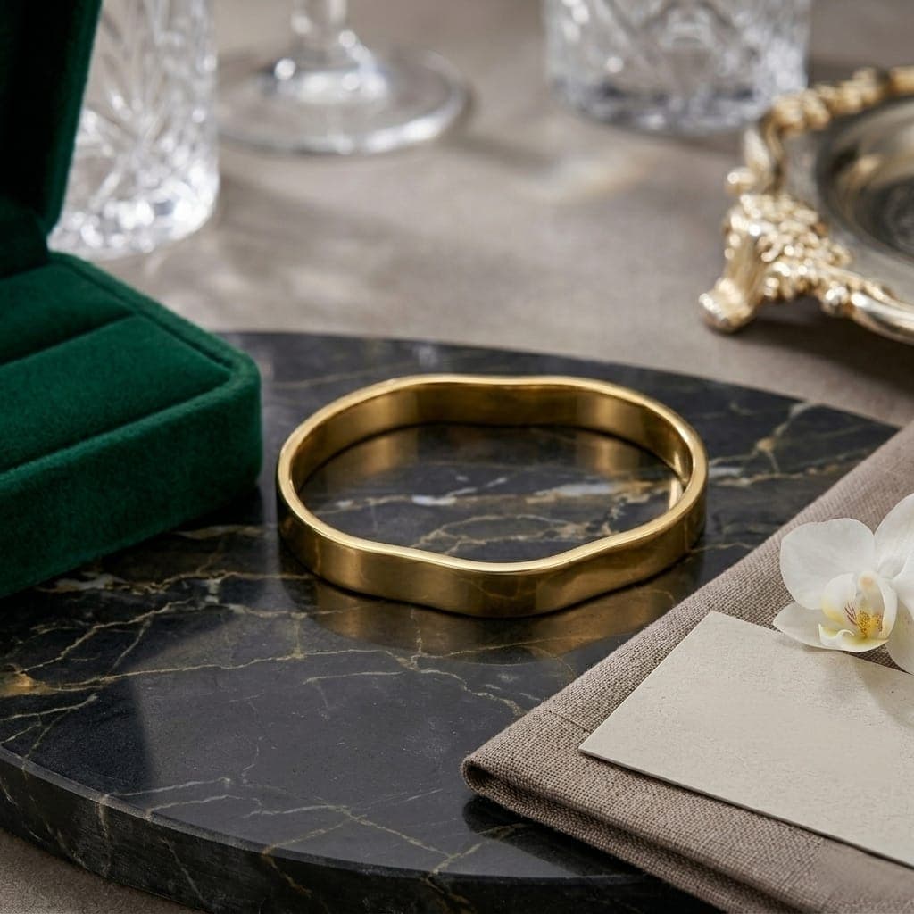A luxurious bracelet in elegant gold, featuring a unique, flowing, and polished wave design. It adds a touch of modern luxury to your look. An attractive design for any occasion. Women's Bangles (6)