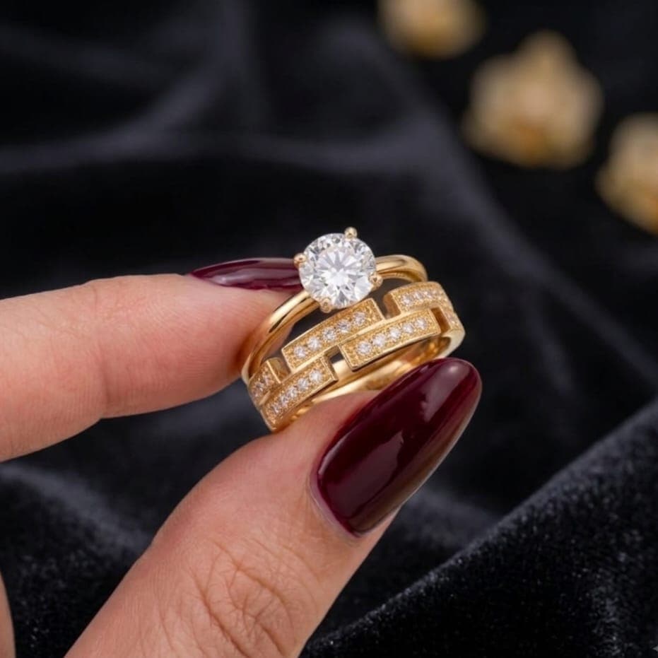 An elegant gold ring, combining the brilliance of a captivating central cubic zirconia stone with a geometric, openwork design paved with sparkling, delicate cubic zirconia stones. A truly eye-catching luxury! Women's Rings (4)