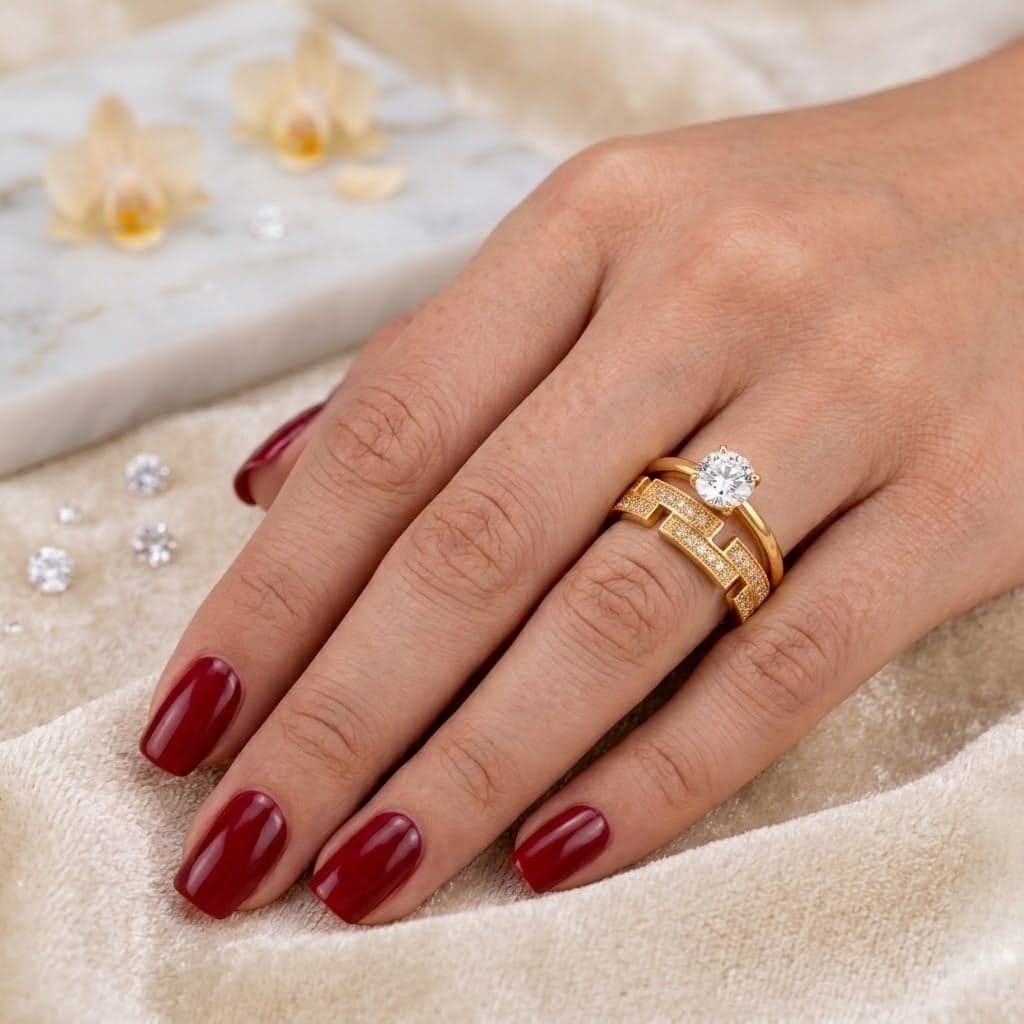 An elegant gold ring, combining the brilliance of a captivating central cubic zirconia stone with a geometric, openwork design paved with sparkling, delicate cubic zirconia stones. A truly eye-catching luxury! Women's Rings (5)