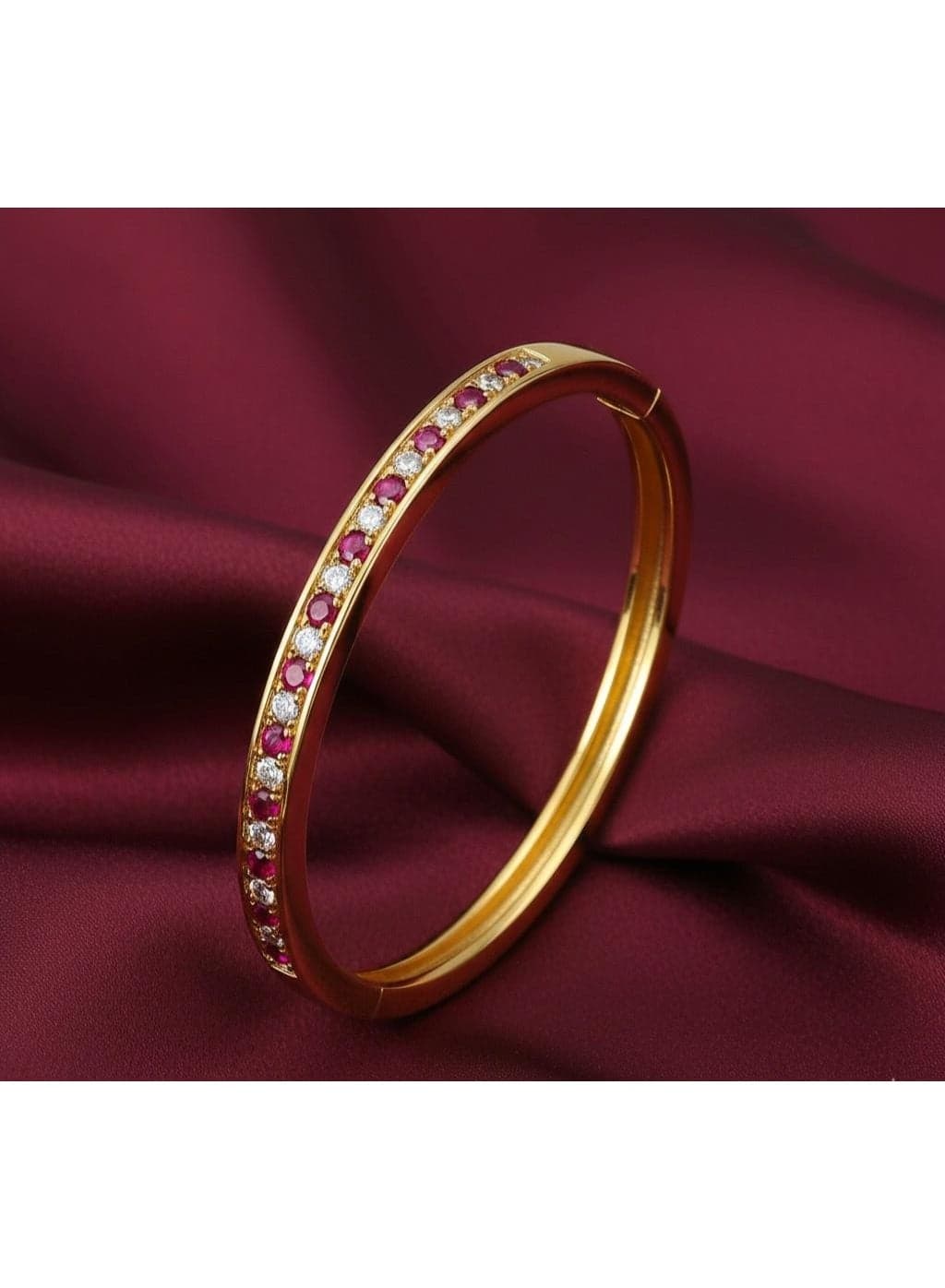 A luxurious gold bracelet studded with sparkling rubies and white zircon stones, adding an unparalleled touch of elegance to your look. Women's Bracelets & Bangles (4)