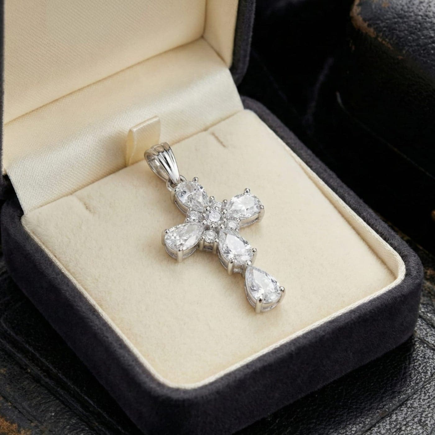 A silver cross pendant (without chain) studded with sparkling pear-shaped and round zircon stones, an elegant design that combines luxury and simplicity and adds a spiritual touch. Women's Necklaces (٤)