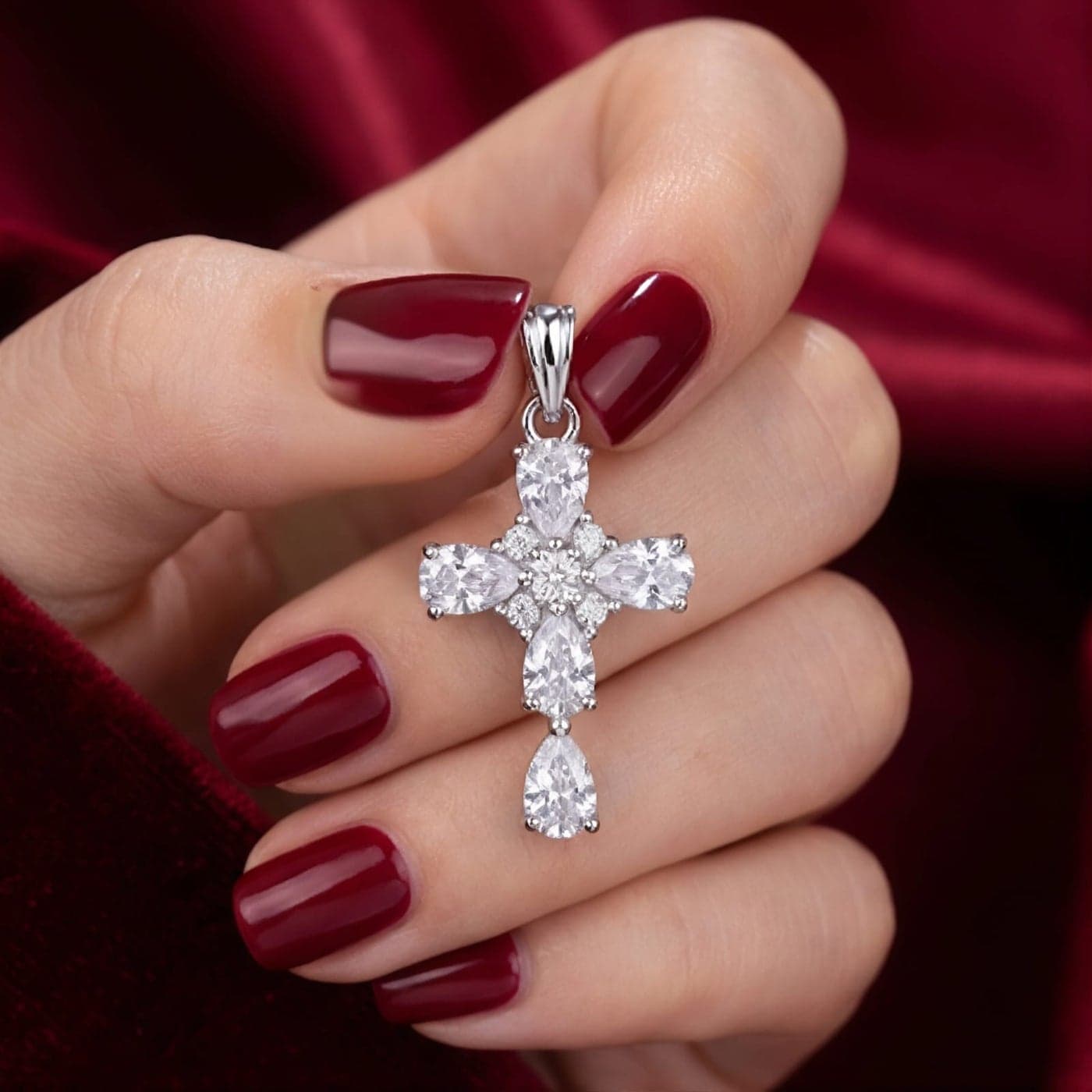 A silver cross pendant (without chain) studded with sparkling pear-shaped and round zircon stones, an elegant design that combines luxury and simplicity and adds a spiritual touch. Women's Necklaces