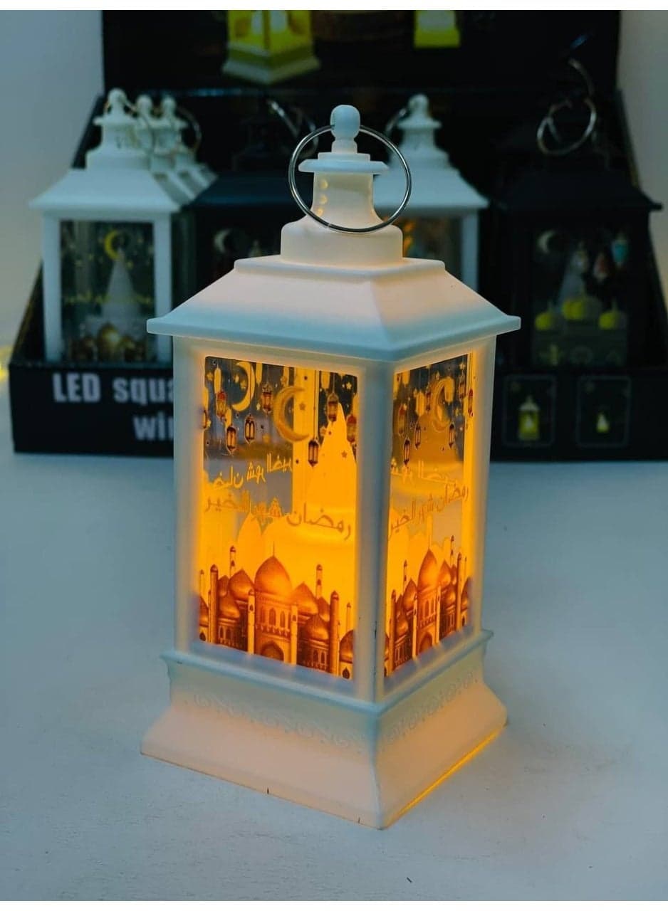 Ramadan lantern collection, imported plastic lanterns, Ramadan lantern stand with Ramadan-themed designs, lights, and a black and white lantern. Operates on clock batteries. Candle Lanterns (٥)