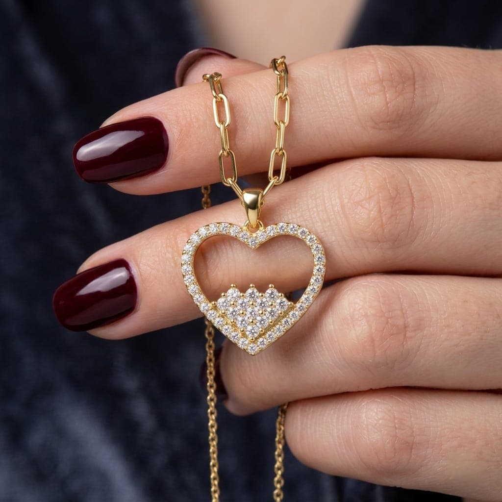 An elegant gold necklace made of rust-resistant stainless steel, featuring an open heart studded with sparkling zircon stones that enhance your elegance, with an adjustable clasp to suit you. (4)