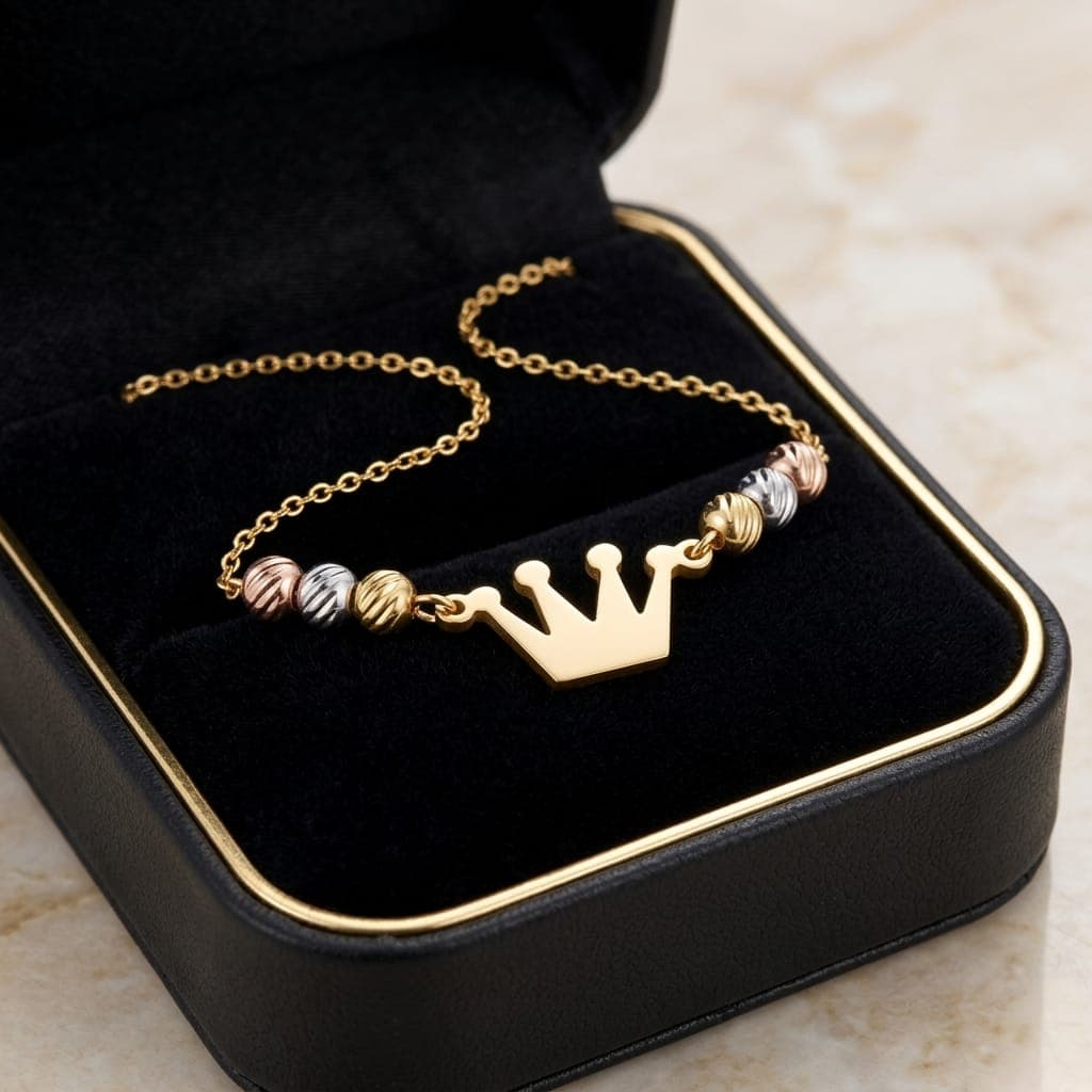 A regal necklace adorned with a gold crown pendant and colorful beads in a luxurious design, giving you a touch of elegance and distinction. It features an adjustable clasp for a perfect fit. Women's Necklaces (٦)