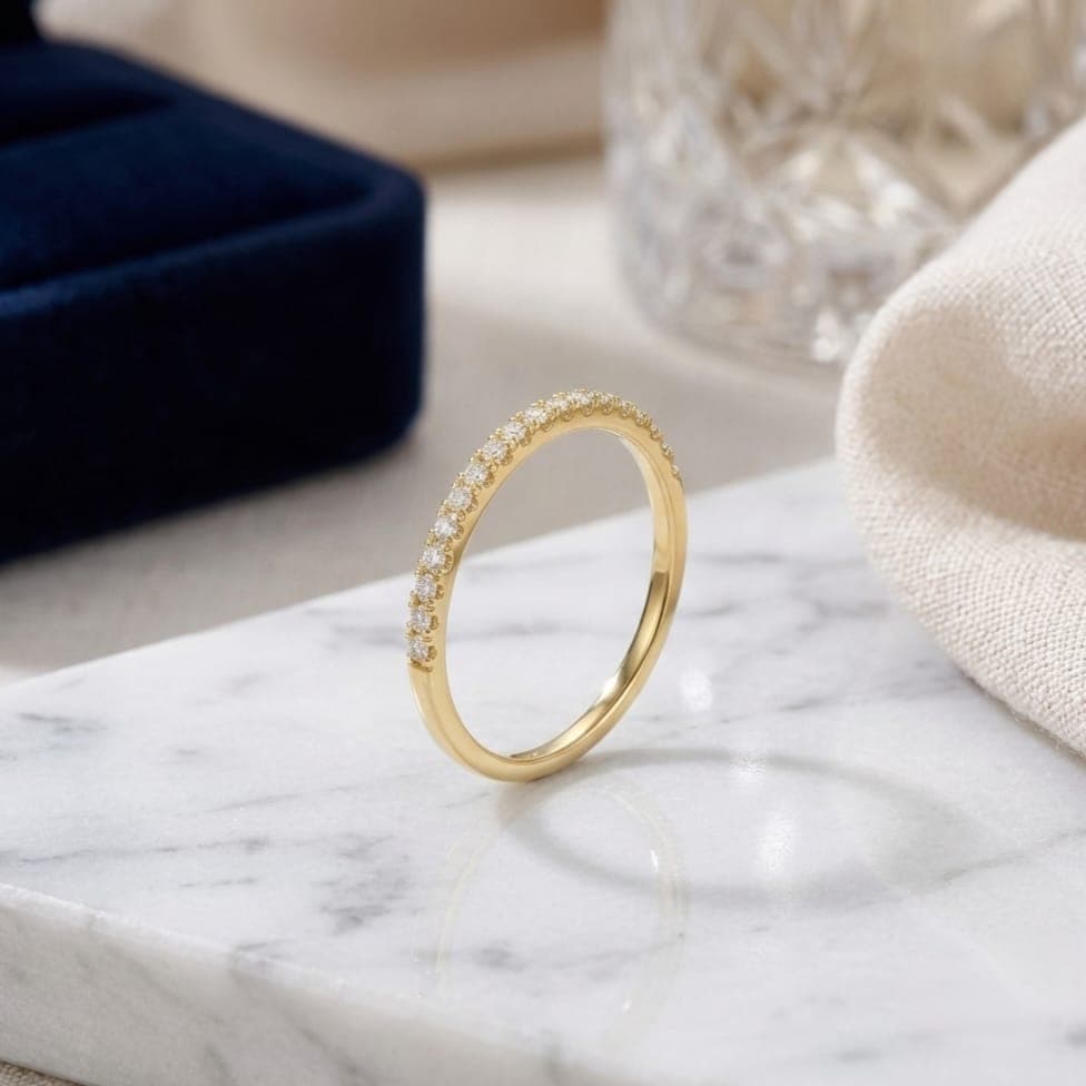 An elegant gold ring with a delicate and refined design, adorned on the front with a row of sparkling, micro-stones. A subtle piece that accentuates your femininity and complements your everyday look with ease. Women's Rings (7)