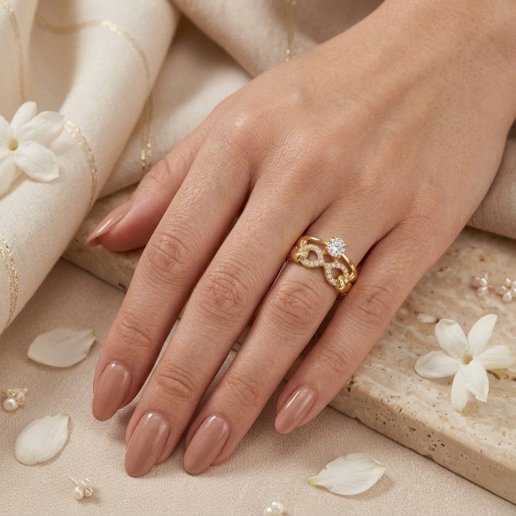An elegant gold ring, sparkling with a dazzling central stone. With its intricate infinity design, carefully set with brilliant zircon stones, it adds allure and luxury to your look. Women's Rings (٤)