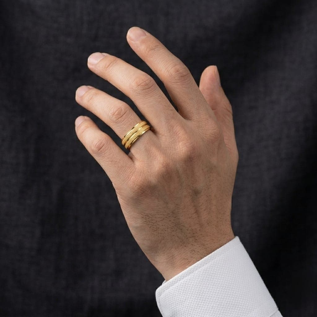A unisex gold-tone ring, crafted from durable stainless steel, featuring a brilliant shine and sparkling details for an attractive look. Perfect for engagements and special occasions! Women's Rings (6)