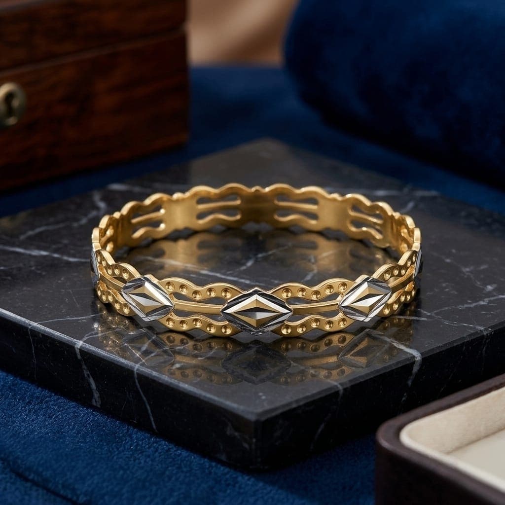A luxurious bracelet in elegant gold, sparkling with wavy, openwork edges and attractive silver-colored geometric details that give you a charming and eye-catching modern look. Women's Bangles (5)