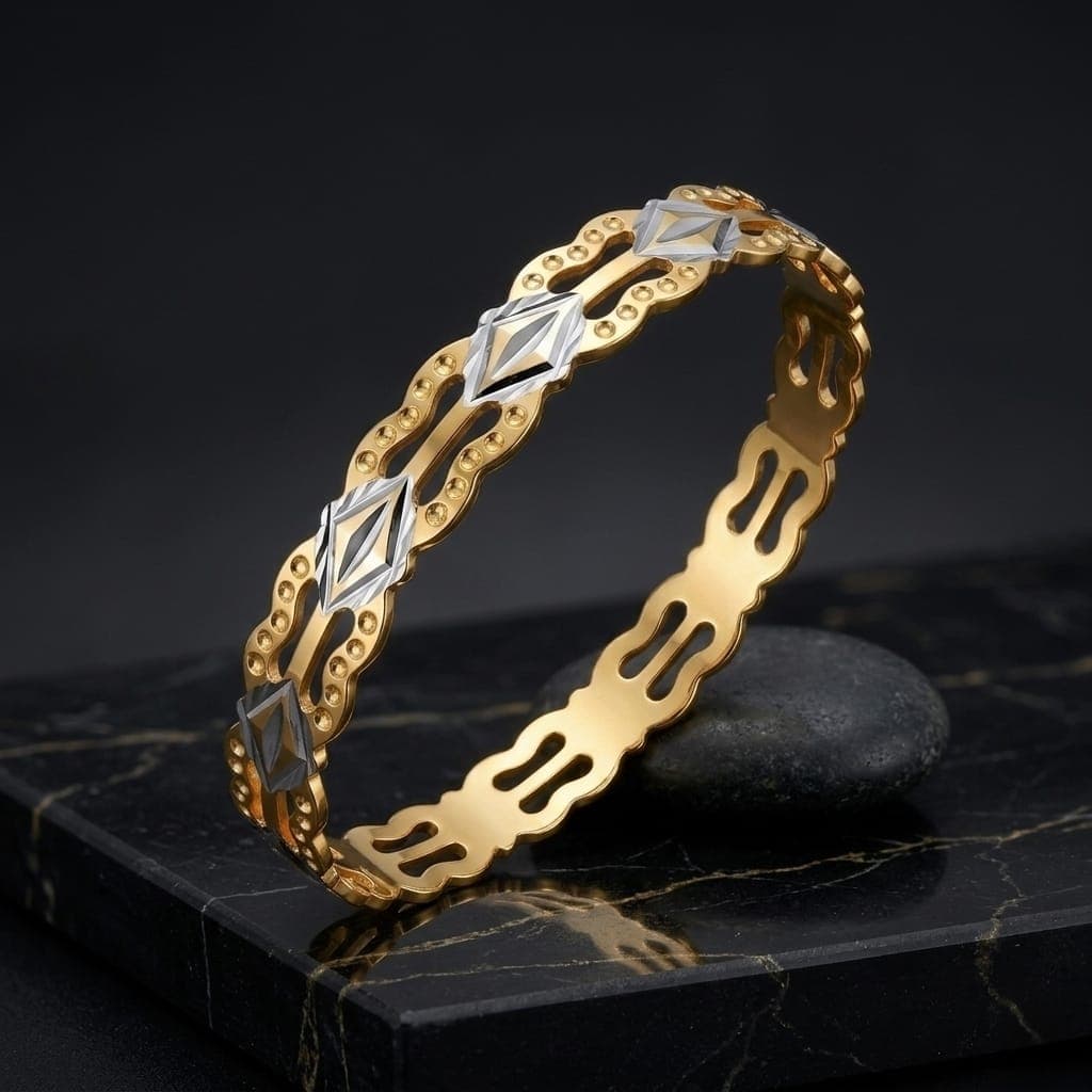 A luxurious bracelet in elegant gold, sparkling with wavy, openwork edges and attractive silver-colored geometric details that give you a charming and eye-catching modern look. Women's Bangles (6)