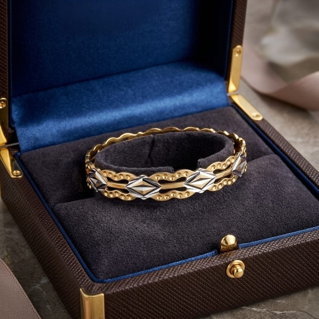 A luxurious bracelet in elegant gold, sparkling with wavy, openwork edges and attractive silver-colored geometric details that give you a charming and eye-catching modern look. Women's Bangles (7)