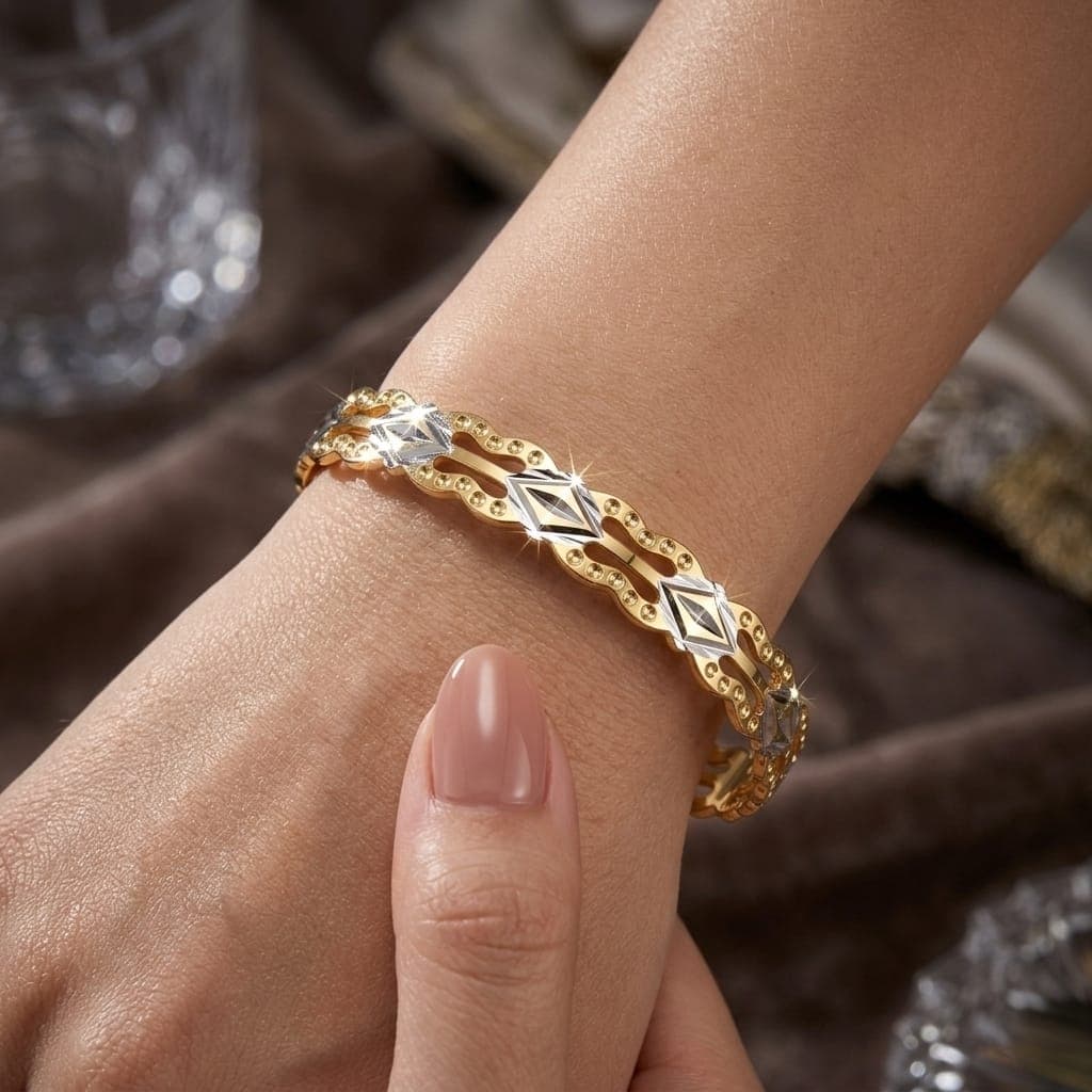 A luxurious bracelet in elegant gold, sparkling with wavy, openwork edges and attractive silver-colored geometric details that give you a charming and eye-catching modern look. Women's Bangles (3)