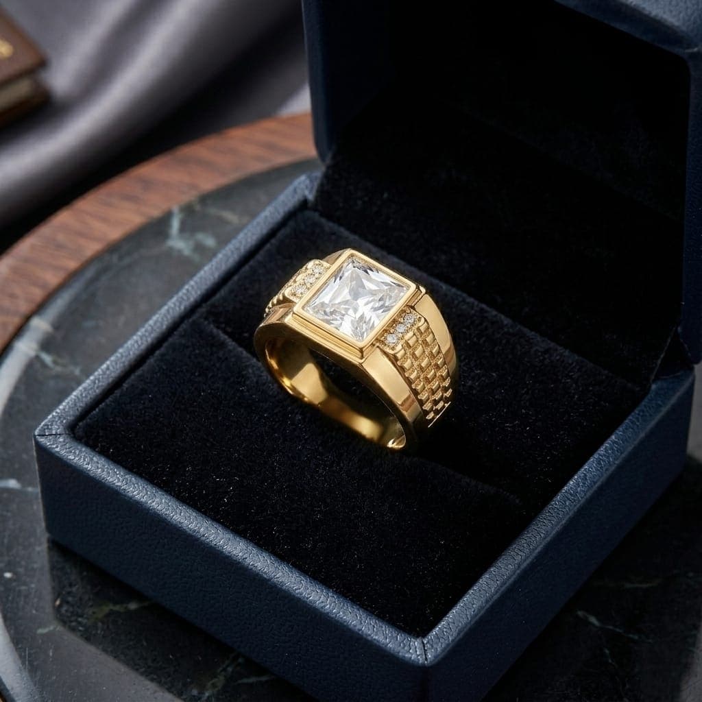 A luxurious gold men's ring, with a pure white royal rectangular stone in the center, and sides decorated with raised engravings and shiny zircon stones, giving you a luxurious and attractive look on every occasion. (6)