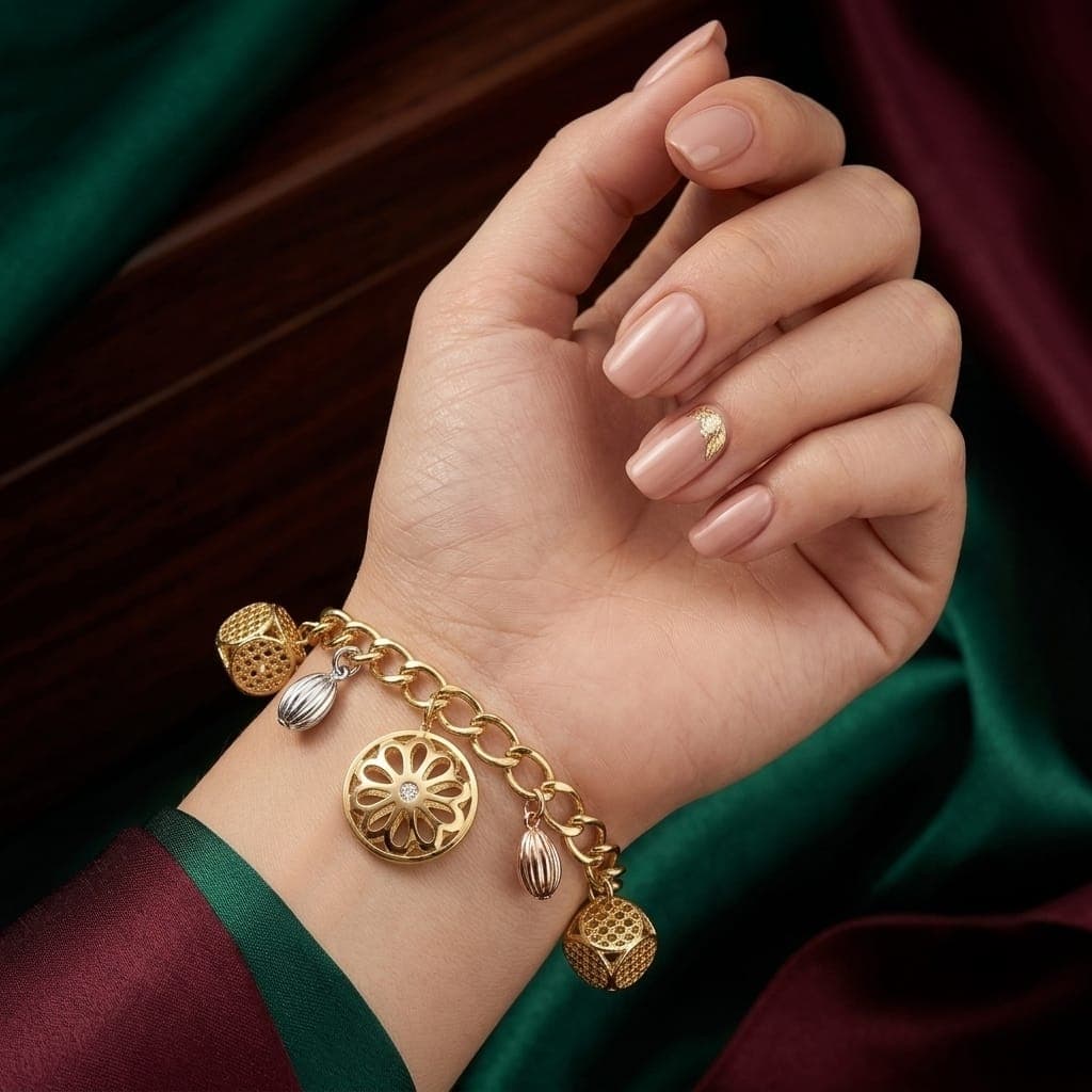 An elegant gold bracelet, sparkling with charming hollow cube and circular pendants interspersed with drops in silver and pink, with an adjustable clasp to suit you. Women's Bracelets & Bangles (٥)