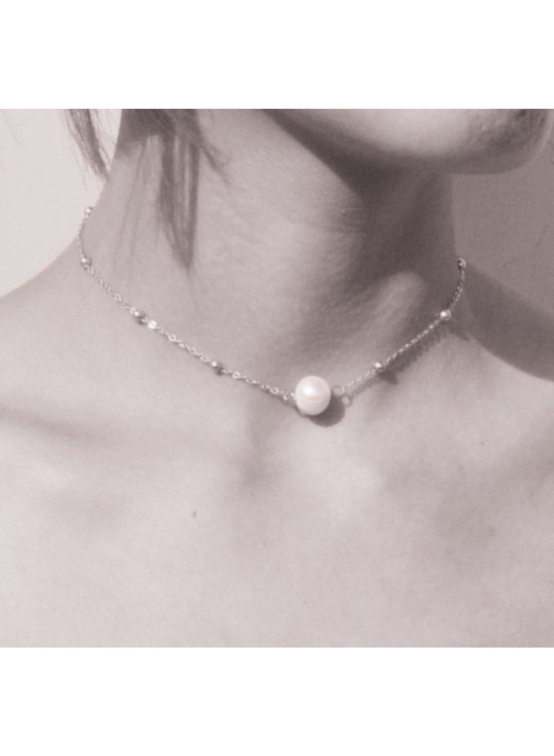 Women's Necklace Of Off-White Pearls with Silvery Chain