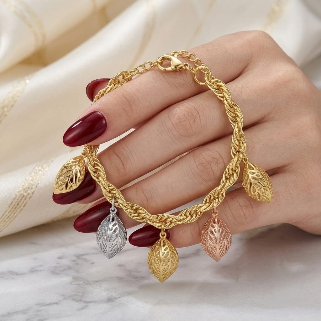 An elegant gold bracelet, with a braided chain adorned with 5 hollow leaf pendants in three attractive colors (gold, silver, rose gold) with an adjustable clasp to suit you. Women's Bracelets & Bangles (٥)