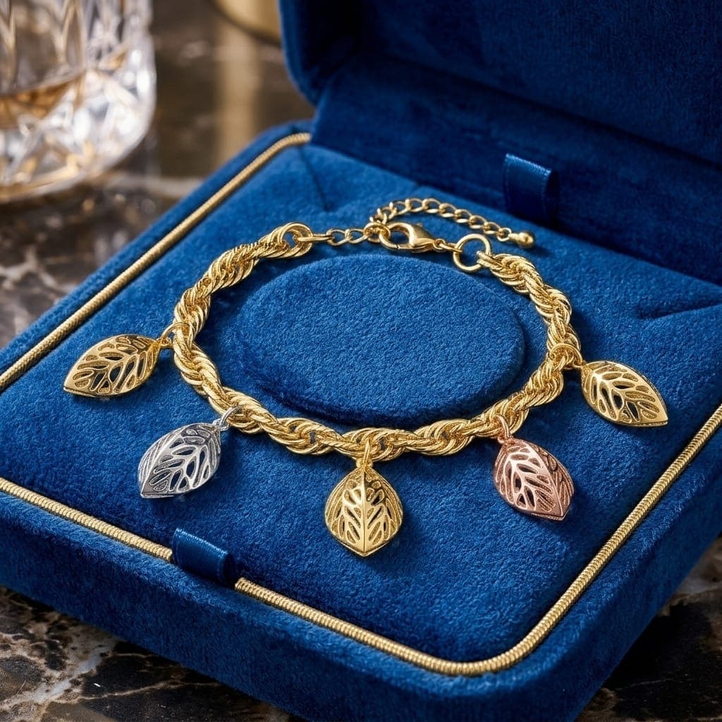 An elegant gold bracelet, with a braided chain adorned with 5 hollow leaf pendants in three attractive colors (gold, silver, rose gold) with an adjustable clasp to suit you. Women's Bracelets & Bangles (٣)