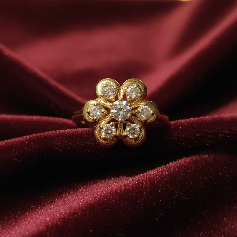 A luxurious gold ring with an elegant flower design, studded with sparkling zircon stones, an open design to ensure a fit for all sizes. Women's Rings (7)