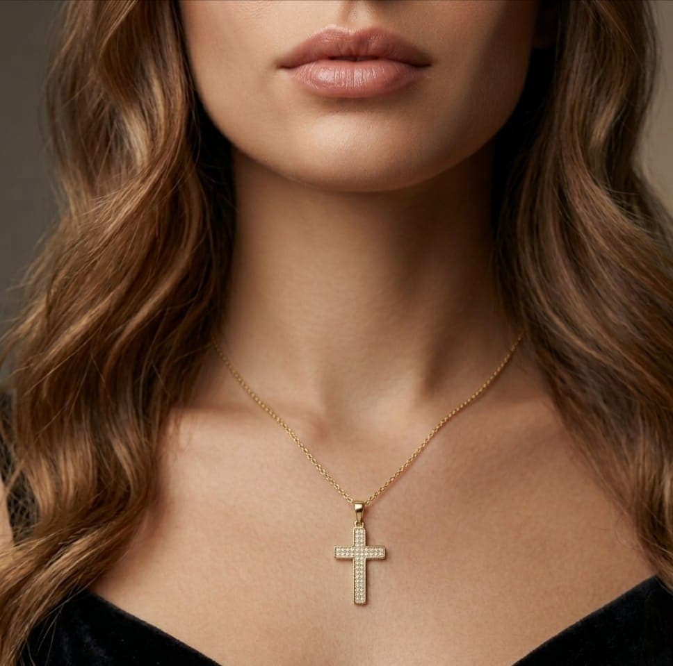 A cross pendant (without chain) in elegant gold, fully studded with tiny shiny zircon stones, giving it an attractive sparkle and sophisticated design. Women's Necklaces (٢)