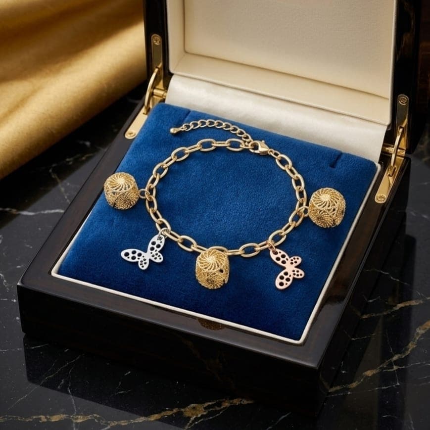 An elegant gold bracelet, decorated with three hollow gold cubes and two delicate butterflies in silver and pink, with an adjustable clasp to fit you. Women's Bracelets & Bangles (6)