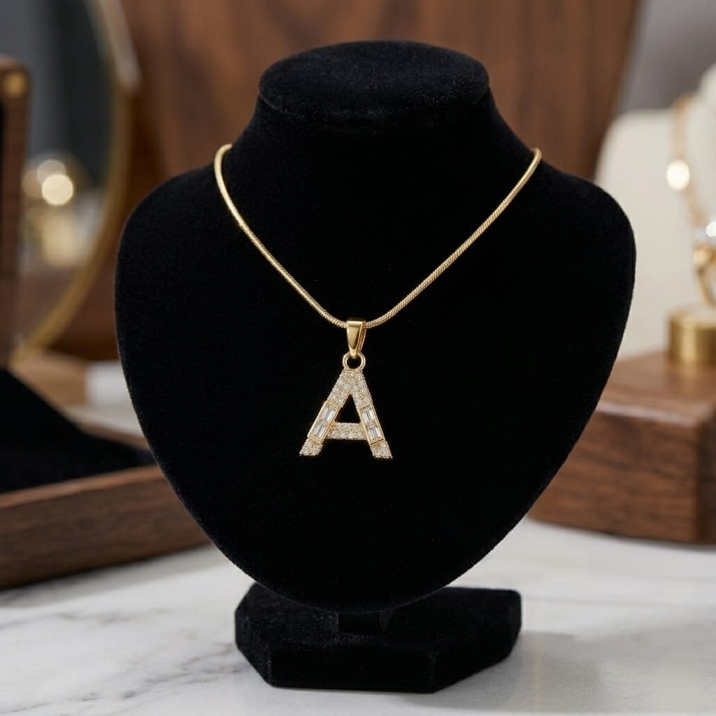 A luxurious, elegant gold necklace with a sumptuous letter A pendant studded with sparkling baguette and zircon stones, and an adjustable clasp to fit you. Women's Necklaces (٧)