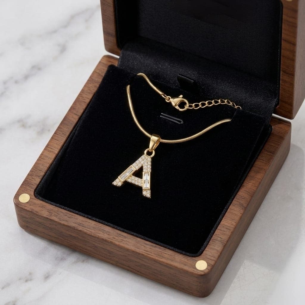 A luxurious, elegant gold necklace with a sumptuous letter A pendant studded with sparkling baguette and zircon stones, and an adjustable clasp to fit you. Women's Necklaces (٦)
