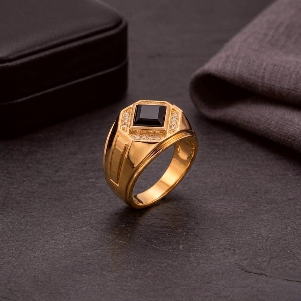 A men’s ring in luxurious red gold, featuring a royal black stone surrounded by sparkling zircon stones. A design that combines prestige and modern elegance to suit your distinctive presence. (6)