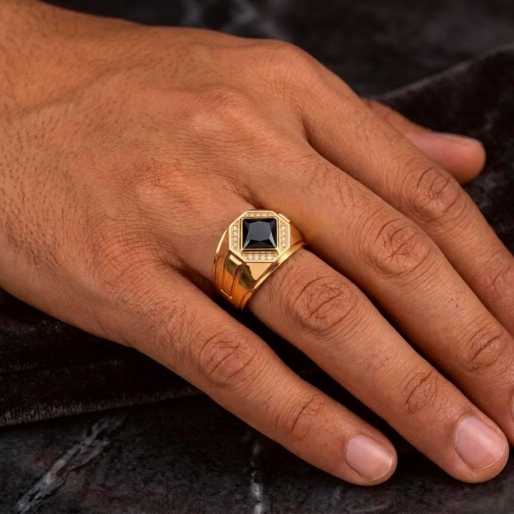 A men’s ring in luxurious red gold, featuring a royal black stone surrounded by sparkling zircon stones. A design that combines prestige and modern elegance to suit your distinctive presence. (4)