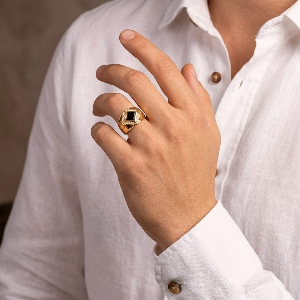 A men’s ring in luxurious red gold, featuring a royal black stone surrounded by sparkling zircon stones. A design that combines prestige and modern elegance to suit your distinctive presence. (3)