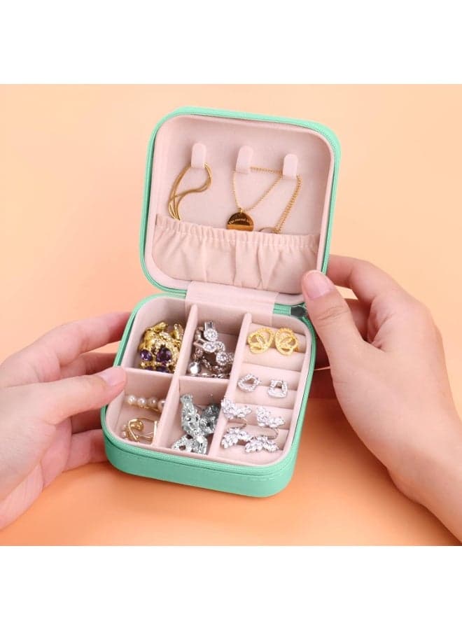 A stylish portable jewelry box in green, with practical compartments for storing rings, earrings and bracelets, ideal for travel and everyday use. Jewellery Organizers (٢)