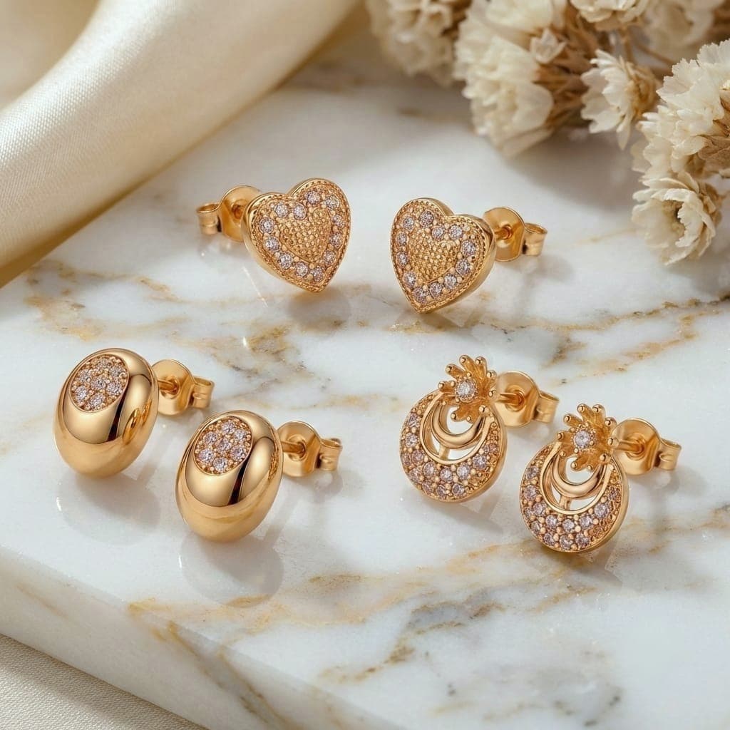 A set of 3 pairs of screw earrings in heart, oval, and crescent shapes, adorned with sparkling zircon stones. A sophisticated design that offers versatility and elegance for everyday wear. Women's Earrings Stud (٧)