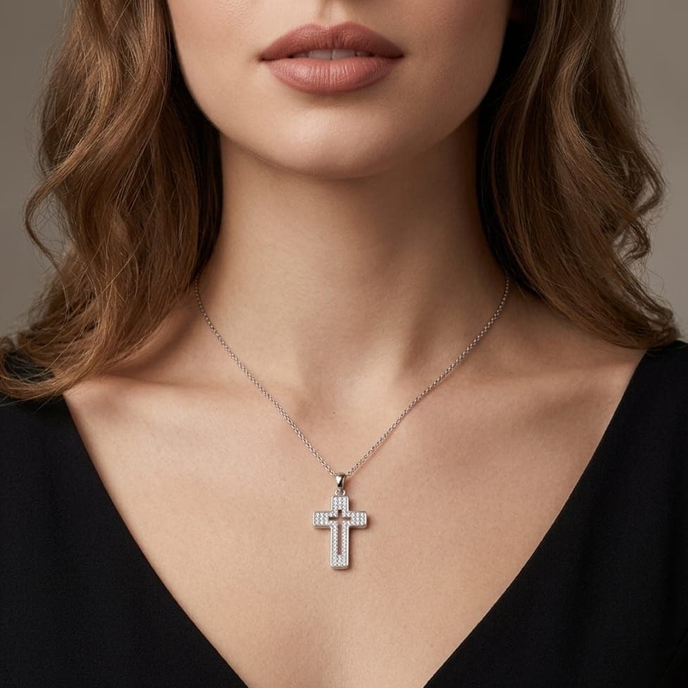 A cross pendant (without chain) in elegant silver, featuring a hollow design in the middle and heavily studded with zircon stones, combining luxury and unique modern beauty. Women's Necklaces (٣)