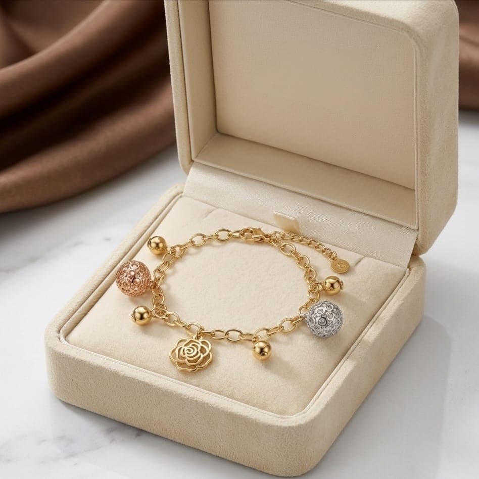 An elegant gold bracelet, decorated with hollow silver and pink balls, and a delicate gold rose with small balls, adds luxury and softness, with an adjustable clasp to suit you. Women's Bracelets & Bangles (٤)