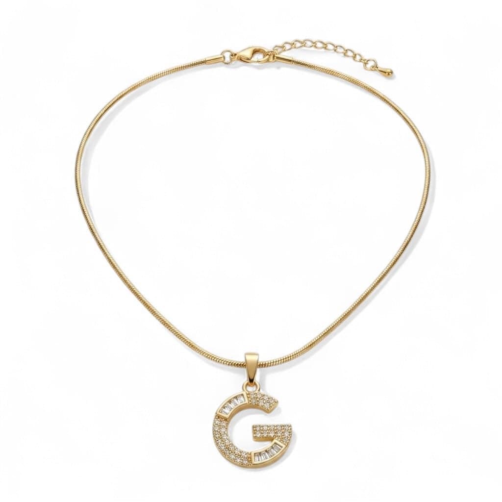 A luxurious, elegant gold necklace with a luxurious letter G pendant studded with sparkling baguette and zircon stones, and an adjustable clasp to fit you. Women's Necklaces