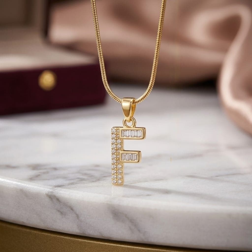 A luxurious, elegant gold necklace with a luxurious letter F pendant studded with sparkling baguette and zircon stones, and an adjustable clasp to fit you. Women's Necklaces (٣)
