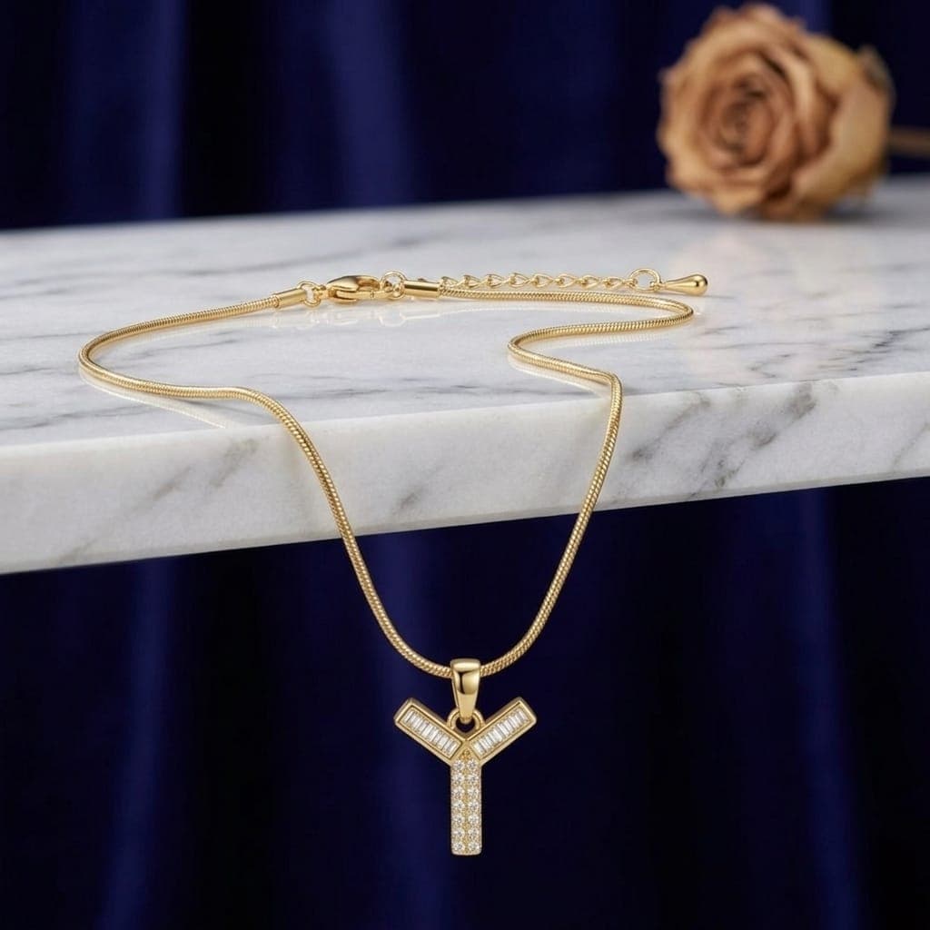 A luxurious, elegant gold necklace with a luxurious Y-shaped pendant studded with sparkling baguette and zircon stones, and an adjustable clasp to fit you. (6)