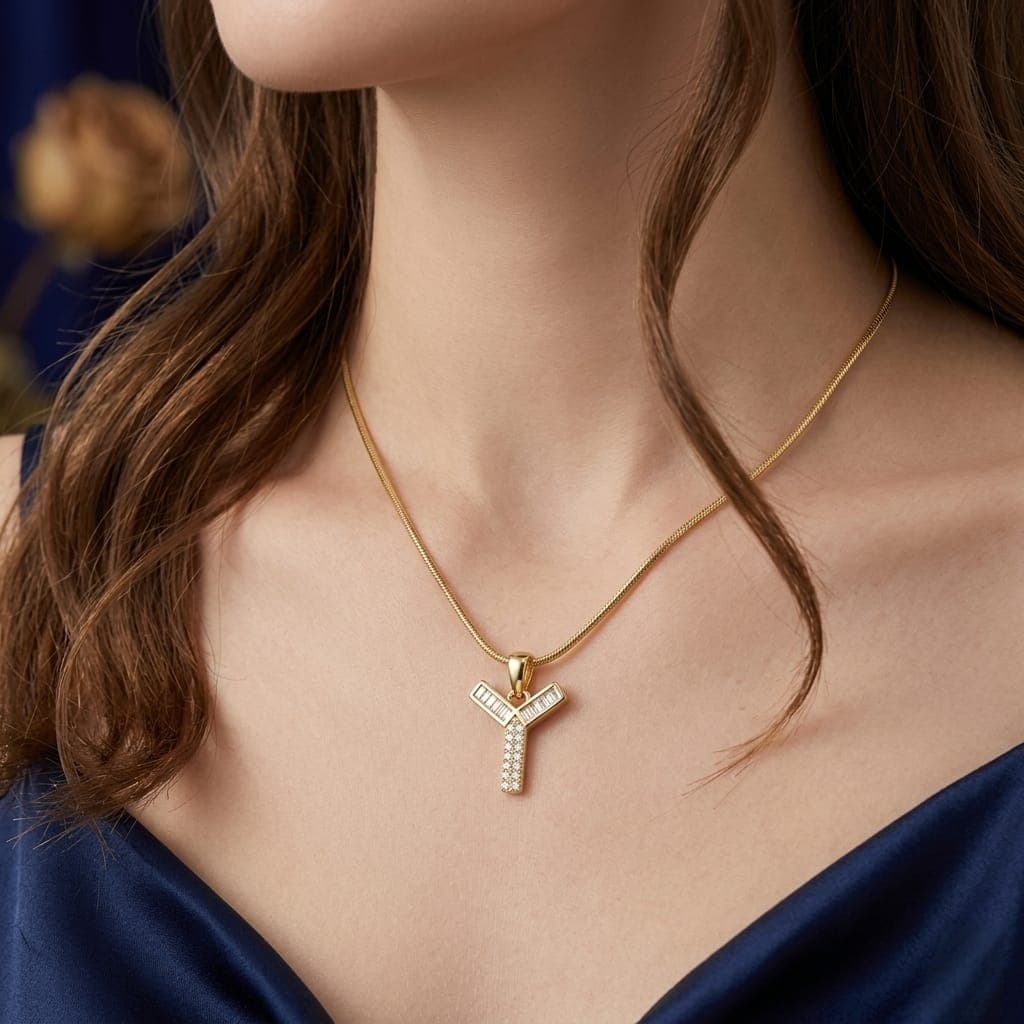A luxurious, elegant gold necklace with a luxurious Y-shaped pendant studded with sparkling baguette and zircon stones, and an adjustable clasp to fit you. (3)