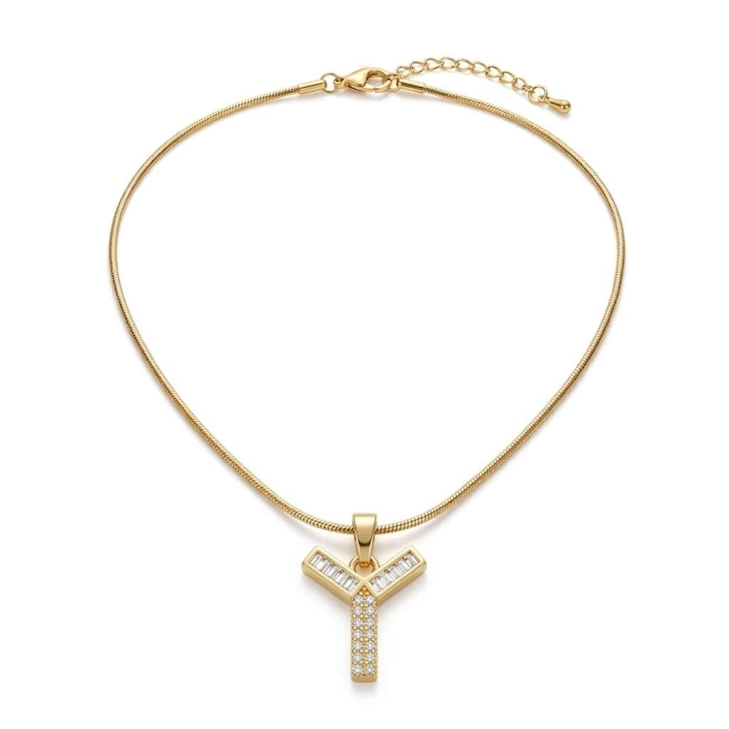 A luxurious, elegant gold necklace with a luxurious Y-shaped pendant studded with sparkling baguette and zircon stones, and an adjustable clasp to fit you.