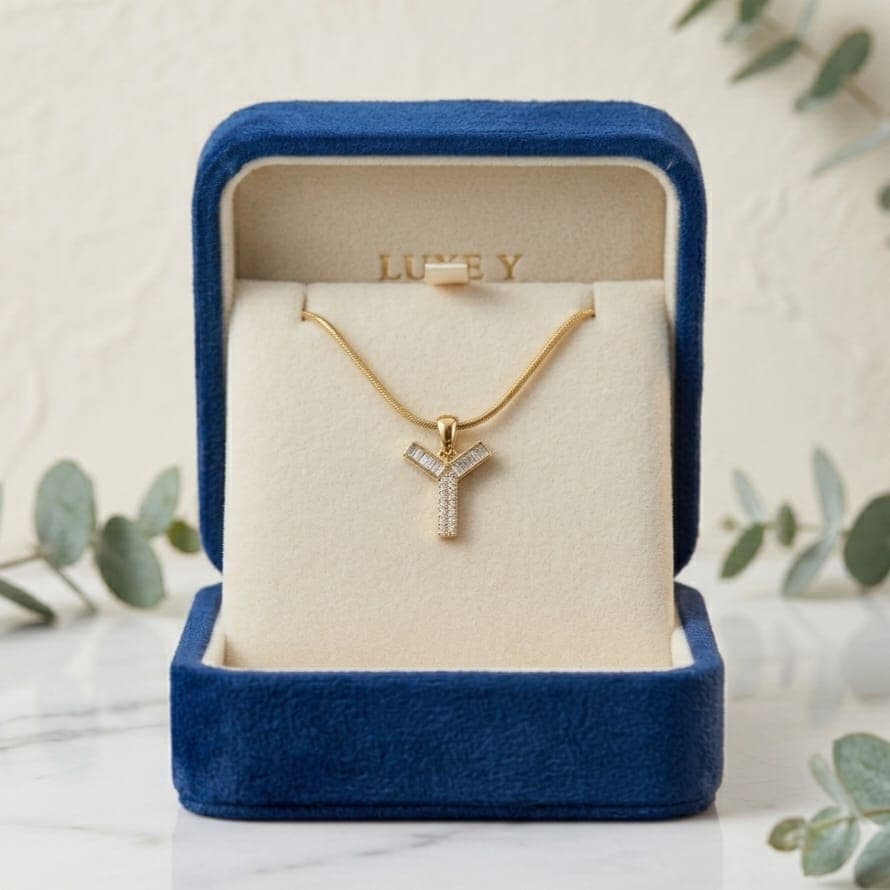 A luxurious, elegant gold necklace with a luxurious Y-shaped pendant studded with sparkling baguette and zircon stones, and an adjustable clasp to fit you. (7)