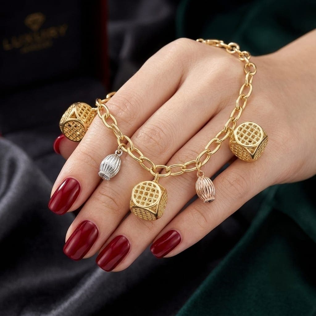 An elegant gold bracelet adorned with gold-colored mesh charms, distinctive silver and pink details, and an adjustable clasp to suit you. Women's Bracelets & Bangles (٥)
