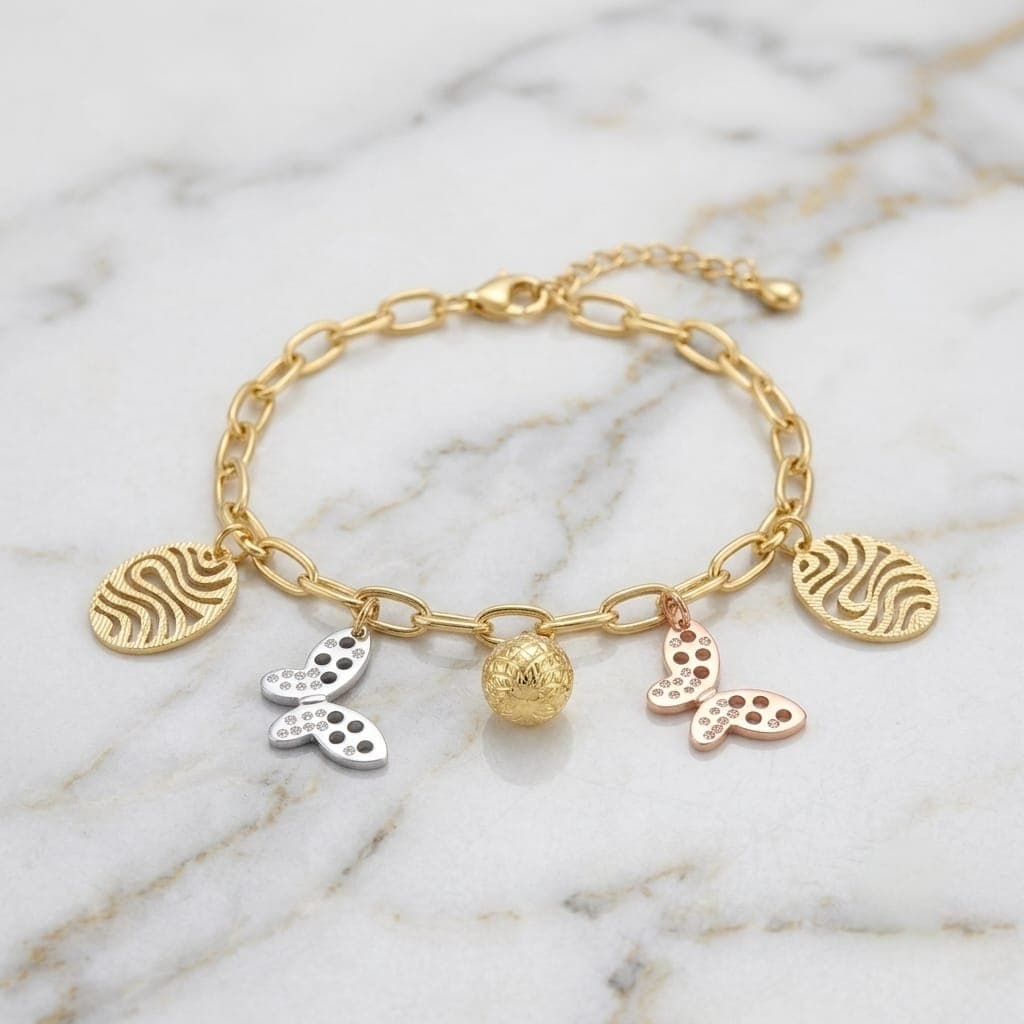 An elegant gold bracelet with luxurious clasp rings adorned with silver and pink butterfly pendants and attractive gold-colored hollow shapes, with an adjustable clasp to suit you. Women's Bracelets & Bangles (٥)